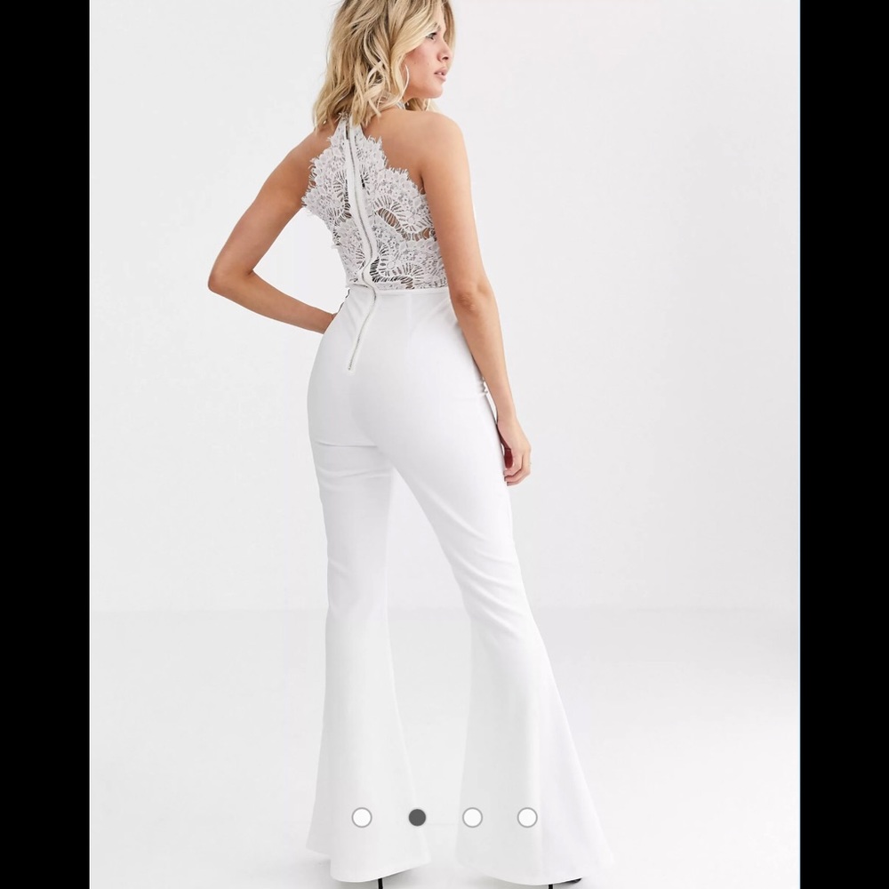 Rare London lace plunge front top wide leg jumpsuit in white.